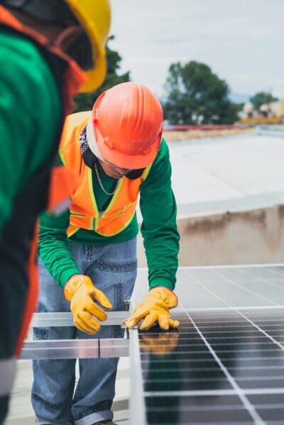 Person working on a solar panel